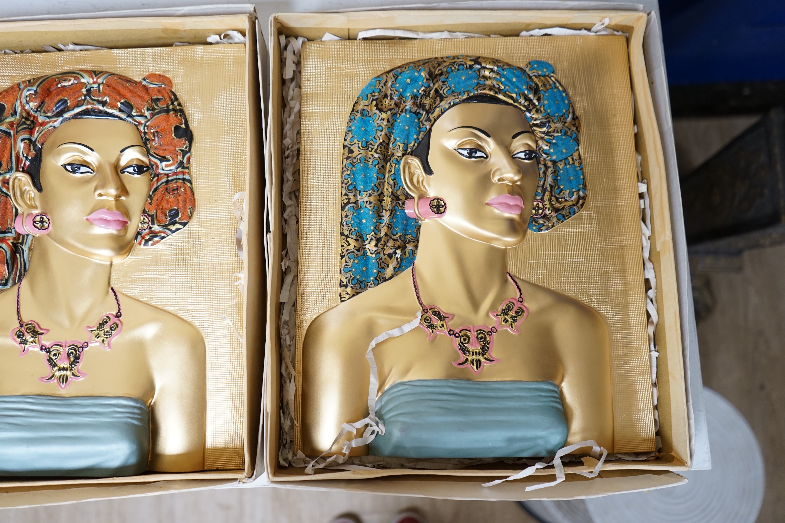 Five moulded and hand painted plaster plaques, busts of women, in original boxes, 35cm high. Condition - good